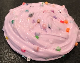 May include: Purple slime with colorful beads, a popular sensory toy for kids.