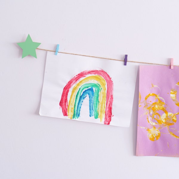 Kids art display with mint green stars and colourful clothespegs, Easy fit childrens art work hanger