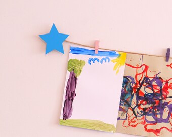 Kids art display with bright blue stars, handmade wooden room decor