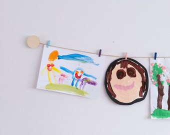 Kids art display with wooden circles and mini clothes pegs, Handmade artwork hanger wall decor