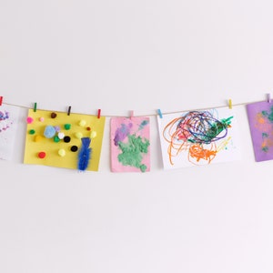 Kids art display with gold stars and colourful clothespegs, Easy fit childrens art work hanger image 2