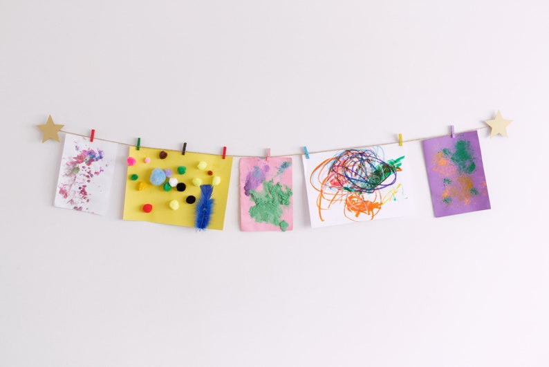 Kids art display with gold stars and colourful clothespegs, Easy fit childrens art work hanger image 2