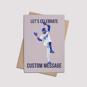 May include: Greeting card featuring a baseball player in a Dodgers uniform. The card has the text "LET'S CELEBRATE" at the top and "CUSTOM MESSAGE" at the bottom. The card is on top of a brown envelope.