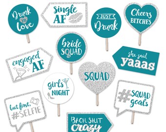May include: Set of 12 teal and silver glitter photo booth props with sayings like "Drunk in love", "Single AF", "Just Drunk", "Cheers Bitches", "Bride Squad", "Engaged AF", "She said yaaaas", "Girls Night", "Squad", "But first, #Selfie", "#Squad goals", and "Bach Shit Crazy".