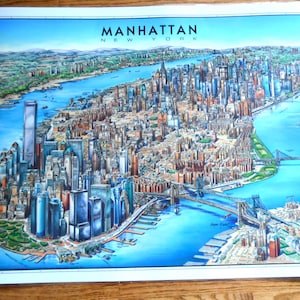 May include: A colorful illustration of Manhattan, New York City, with the text "MANHATTAN NEW YORK" at the top. The illustration shows the city's skyline, bridges, and waterways.