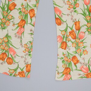 70s floral printed pants showing off the wide leg