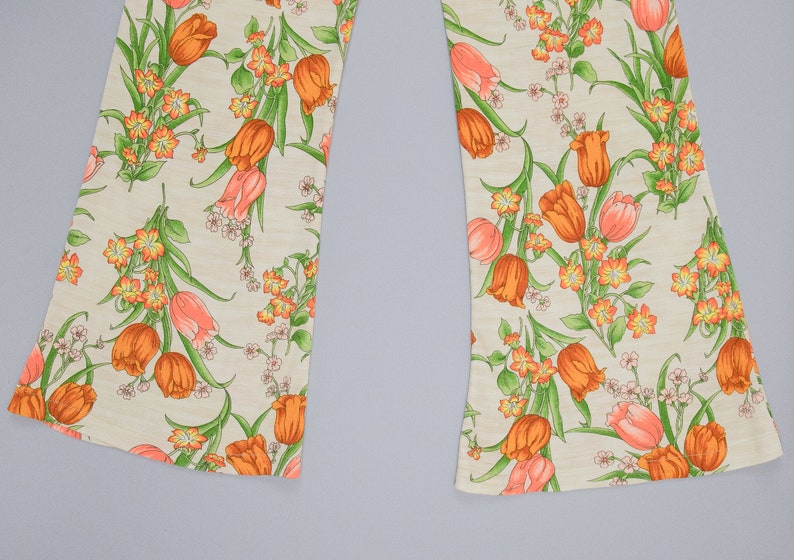 70s floral printed pants showing off the wide leg