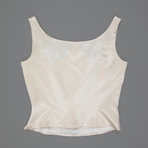 escada silk cream tank corset showing off the back side with scoop neckline, thick tank straps, and side zipper closure from collector of vision store