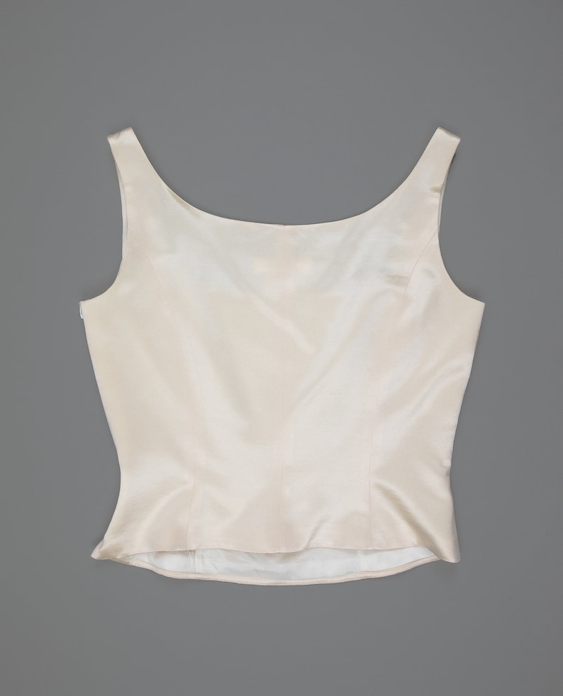escada silk cream tank corset showing off the back side with scoop neckline, thick tank straps, and side zipper closure from collector of vision store