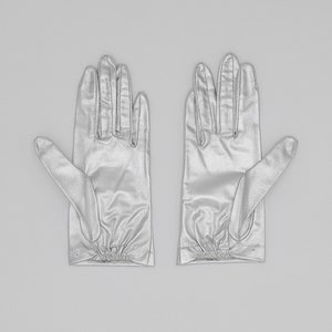 collector of vision deadstock metallic silver gloves in a size XS. Elastic pleated detail on the bottom of the wrist area. An elegant glove that would be perfect for your wedding.