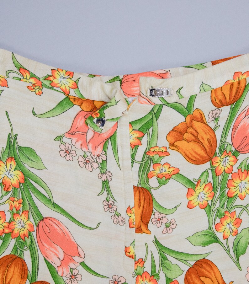 70s floral printed pants showing off the hook and eye closure