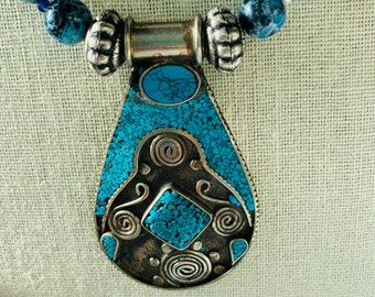 Shades of blue beaded necklace with statement pendant