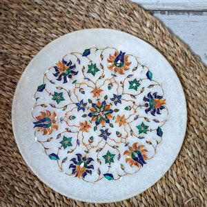 Marble plate with gemstone inlay