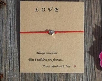 May include: Red string bracelet with a silver heart charm and a card that says "LOVE" and "Always remember that I will love you forever... Handcrafted with love".