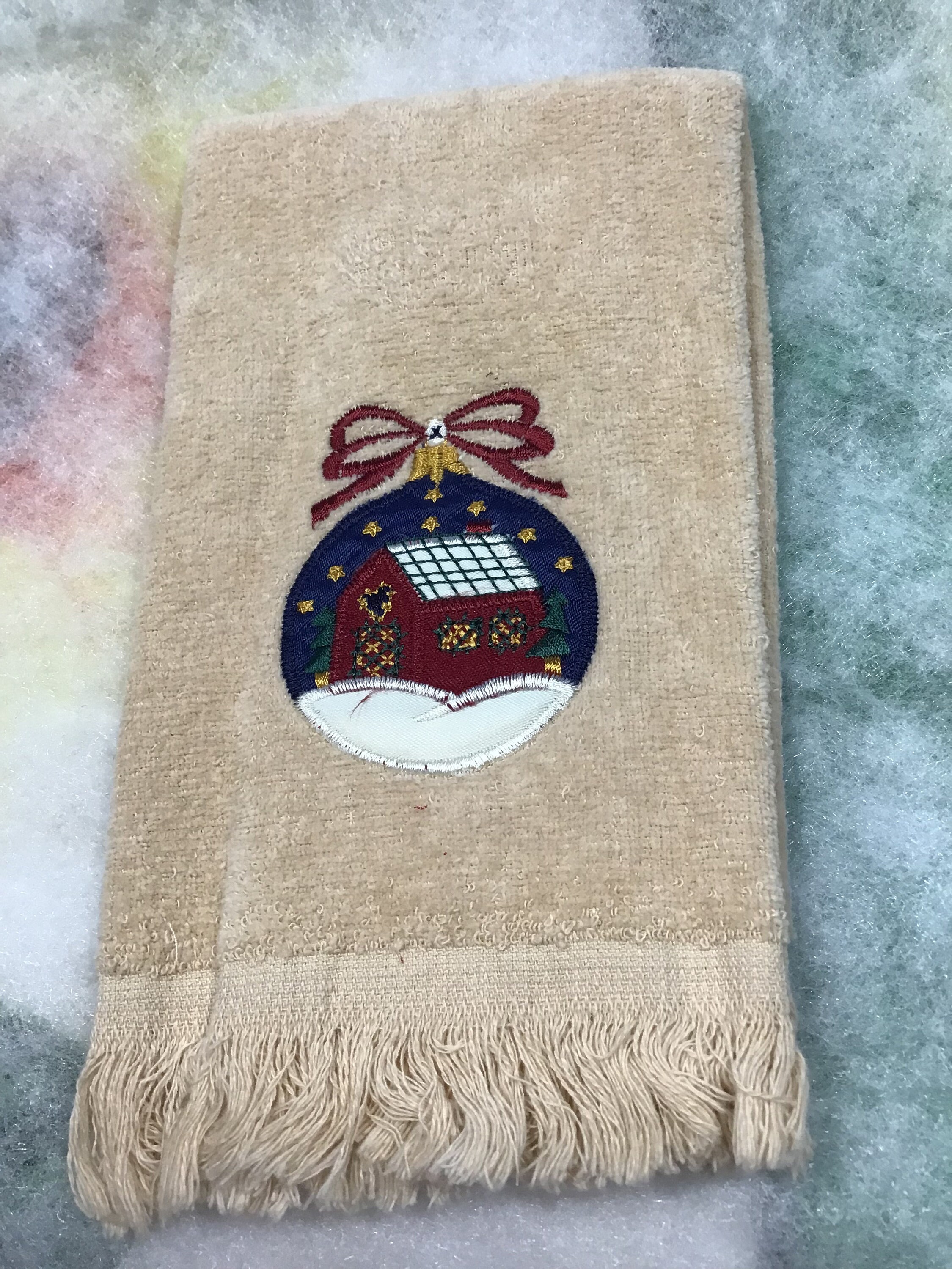Fingertip Hand Towels That Are Embroidered With Christmas Items. One of