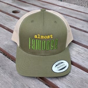 The FLEXFIT  &quot;Almost FAMOOSE&quot; cap. Inspired by a famous Moose and Squirrel.