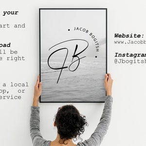 May include: A black and white photo print of a handwritten signature with the text "Jacob Bogitsh." The print is hanging on a white wall. The text "Website: www.Jacobbogitsh.com" and "Instagram: @Jbogitsh.photos" is also visible.
