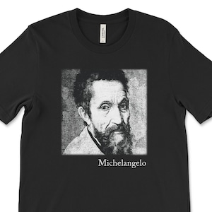 May include: Black t-shirt with a white image of Michelangelo, a famous Renaissance artist, and the text "Michelangelo" below the image.