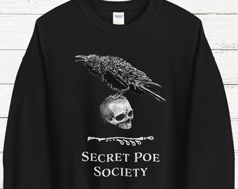 May include: Black sweatshirt with a white graphic of a raven perched on a skull. The text "Secret Poe Society" is printed below the image.