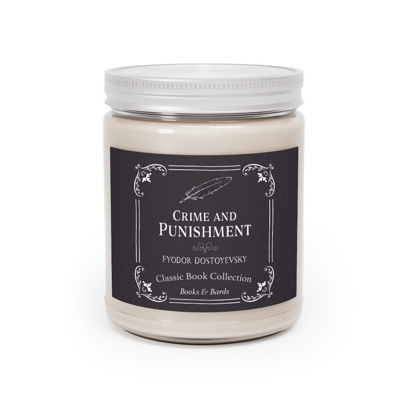 May include: A beige candle jar with a black and white label. The label features a feather design and the text "Crime and Punishment" by Fyodor Dostoevsky. The label also includes the text "Classic Book Collection" and "Books & Bards".