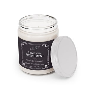 May include: A glass candle jar with a black label that reads "Crime and Punishment" by Fyodor Dostoevsky. The label is part of a Classic Book Collection by Books & Barrels.