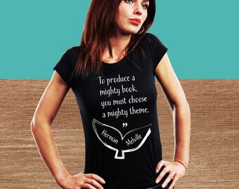 May include: Black t-shirt with a white whale tail graphic and the quote "To produce a mighty book, you must choose a mighty theme." by Herman Melville.