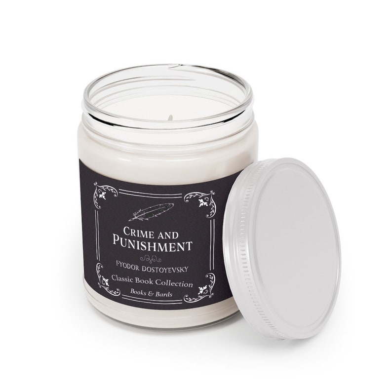 May include: A glass candle jar with a black label that reads "Crime and Punishment" by Fyodor Dostoevsky. The label is part of a Classic Book Collection by Books & Barrels.