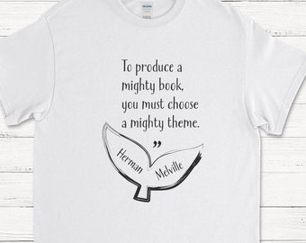 May include: White t-shirt with a black graphic of a whale tail with the quote "To produce a mighty book, you must choose a mighty theme." and the names "Herman Melville" written on the tail.