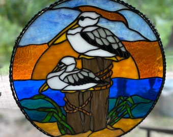 Stained glass pelicans on the pier