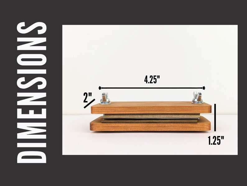 May include: A wooden flower press with metal hardware. The press is rectangular, with dimensions of 4.25 inches wide, 2 inches high, and 1.25 inches deep. The press is designed for pressing flowers and other botanical specimens.