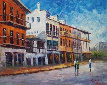 May include: A painting of a street scene with colorful buildings and a blue sky. The buildings have balconies and are lined up along the street. There are three people walking down the street.