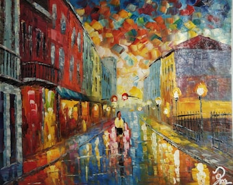 May include: A painting of a city street at night with colorful buildings and a couple walking down the street. The sky is a vibrant blue with orange and red clouds. The street is wet and reflecting the lights of the buildings.