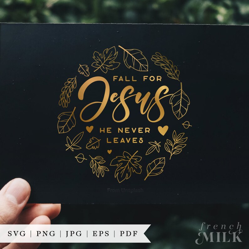 May include: Gold foil design on a black background with the text "Fall for Jesus He Never Leaves". The design is surrounded by a circle of gold leaf outlines of leaves.
