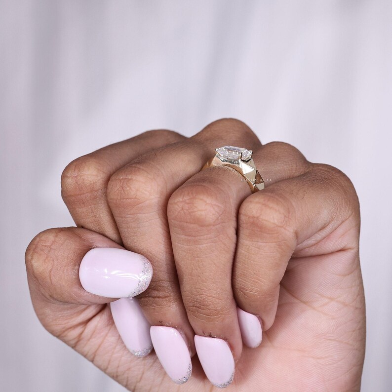 May include: A set of three ceramic mugs with a speckled, matte finish. The mugs are in shades of cream, light gray, and dark gray. Each mug has a simple, minimalist design, perfect for coffee or tea.