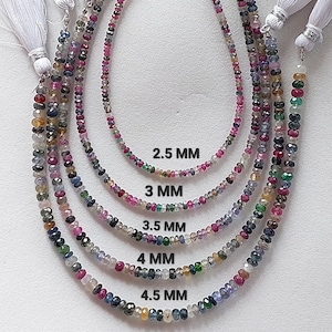 May include: Five strands of colorful gemstone beads in various sizes, ranging from 2.5 mm to 4.5 mm. The beads are a mix of pink, blue, green, and yellow gemstones.