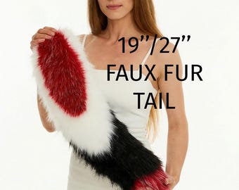 May include: A set of faux fur animal ears and a faux fur tail. The ears are black, white, and red. The tail features a color-blocked pattern of red, white, and black. The text 19"/27" FAUX FUR TAIL is visible, indicating the available lengths.