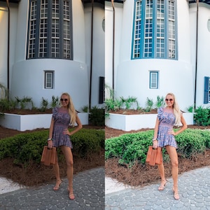 May include: A woman wearing a floral dress and sunglasses is standing in front of a white building with a large window. She is holding a brown handbag.
