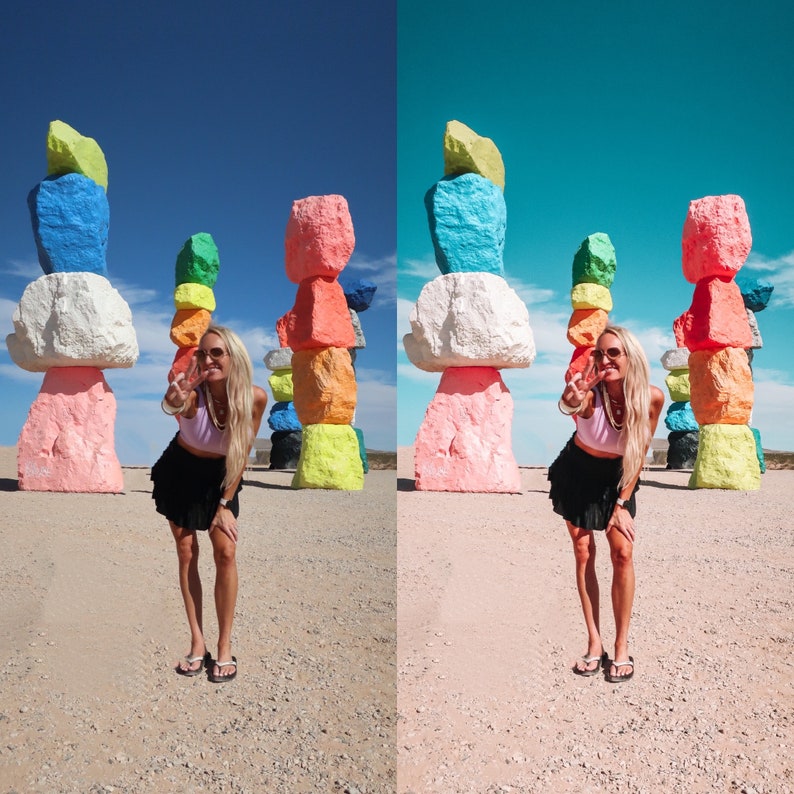 May include: A woman wearing a black skirt and a white top poses in front of a colorful rock sculpture. The sculpture is made of stacked rocks painted in various colors, including pink, blue, green, and yellow.