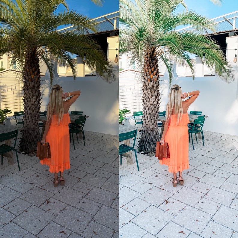 May include: A woman wearing a bright orange dress and brown handbag stands in front of a white building with a palm tree in the background.