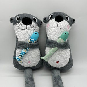 customizable otter with fish, terry cloth gray / white, approx. 27x15x9cm