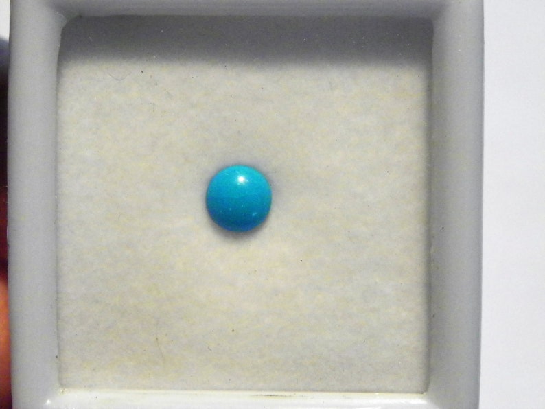 Sleeping Beauty Turquoise loose gemstone 6mm round .58 ct in plastic case