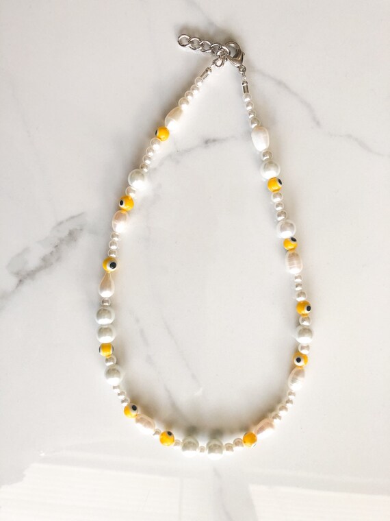 Harry styles evil eye necklace deals
