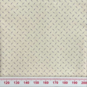 May include: A close-up of a beige fabric with a repeating pattern of small purple diamonds. A ruler is visible at the bottom of the image with markings from 120 to 200.