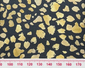 Gold animal print on dark grey cotton. Perfect for small scale crafts and patchwork.