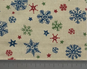 Various snowflakes on beige cotton