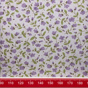 Purple flowers on a lilac cotton.