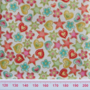 Vibrant hearts, flowers and star cotton print.