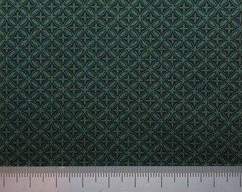 Black circles on green cotton background. Perfect for small scale crafts.