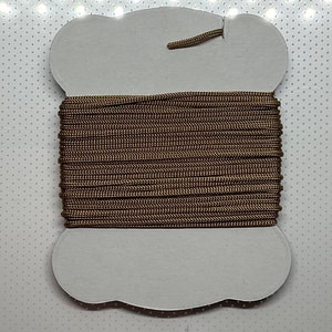 Bunka thread in bronze brown. Great for miniatures and embroidery. 6m card