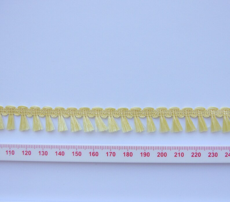 Tufted fringe braid Yellow price per metre image 1